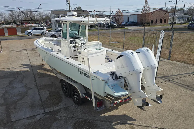 Slide: The Image of 2018 Everglades 273 Center Console boat with dual engines on a trailer. - 25