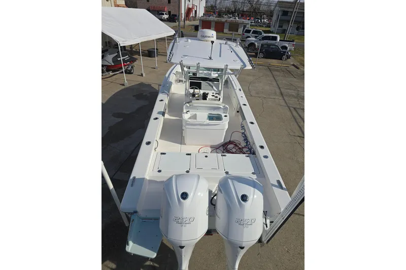 Slide: The Image of 2018 Everglades 273 Center Console boat with dual 250 horsepower engines. - 26