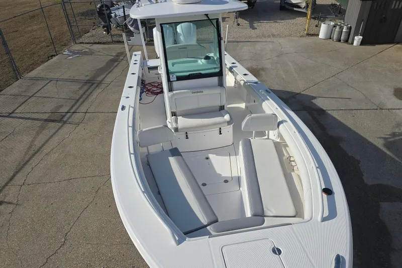 Slide: The Image of 2018 Everglades 273 Center Console boat with spacious seating and sleek design. - 27