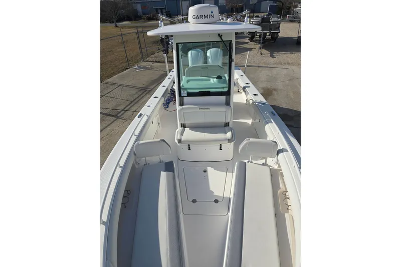 Slide: The Image of 2018 Everglades 273 Center Console boat with Garmin equipment, docked outdoors. - 28