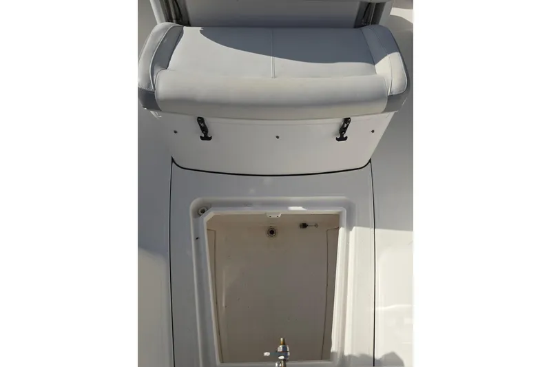 Slide: The Image of 2018 Everglades 273 Center Console boat interior with seating and storage compartment. - 30