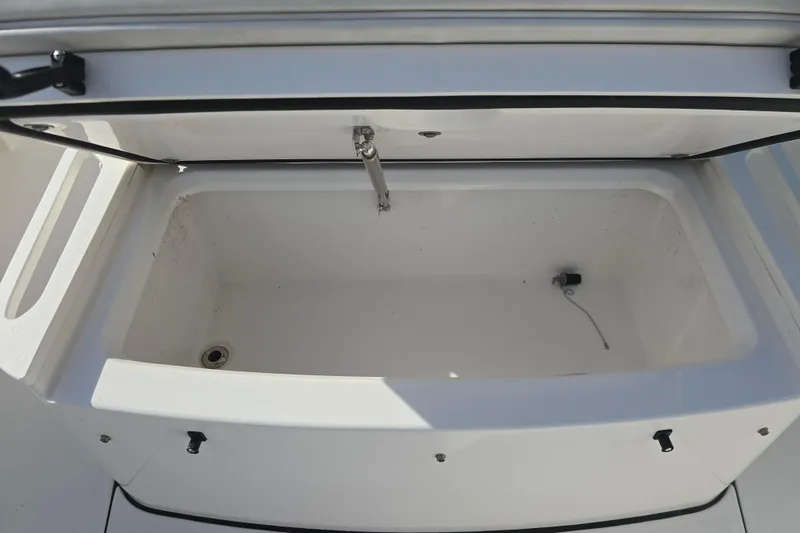 Slide: The Image of Open storage compartment on 2018 Everglades 273 Center Console boat. - 31