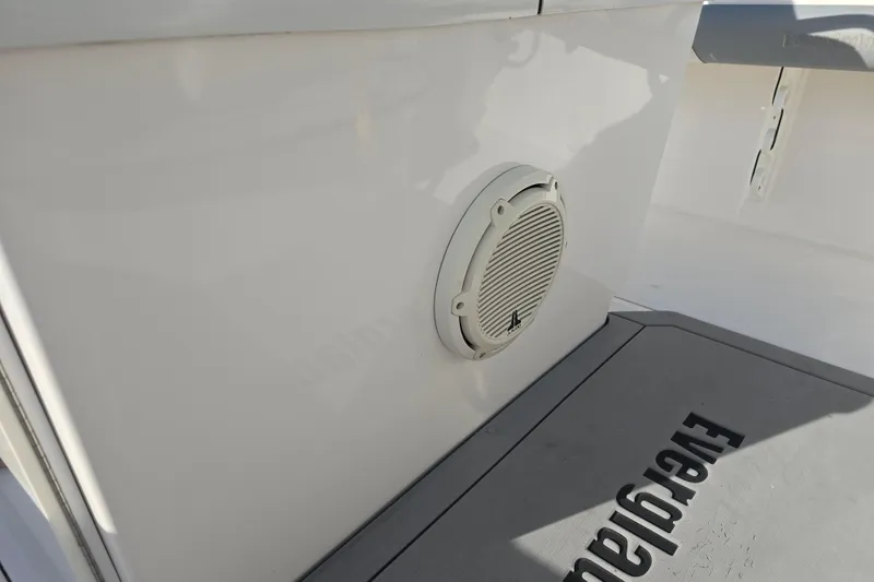 Slide: The Image of 2018 Everglades 273 Center Console boat interior with speaker and branded flooring. - 34