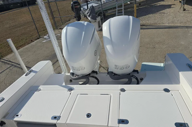 Slide: The Image of 2018 Everglades 273 Center Console with dual Yamaha 250 engines, docked outdoors. - 38