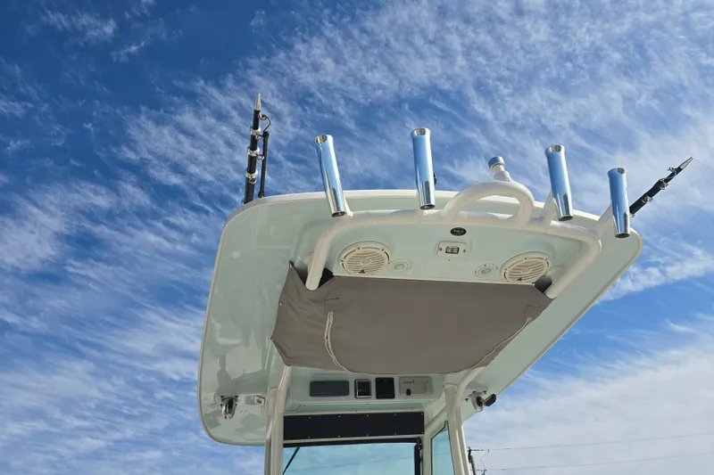 Slide: The Image of 2018 Everglades 273 Center Console boat against a clear blue sky. - 44