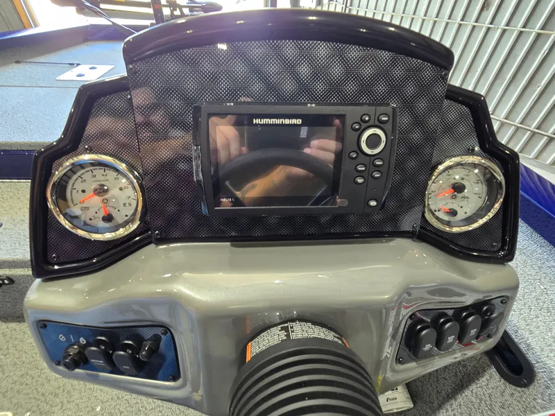 Slide: The Image of Dashboard of 2025 G3 Sportsman 1710 boat with Humminbird display and gauges. - 13