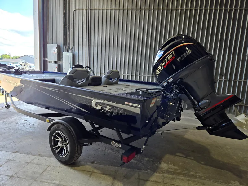 Slide: The Image of 2025 G3 Sportsman 1710 boat with Yamaha motor in a garage setting. - 4