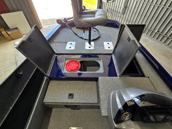 Slide: The Image of 2025 G3 Sportsman 1710 boat interior with storage compartments and seating. - 5