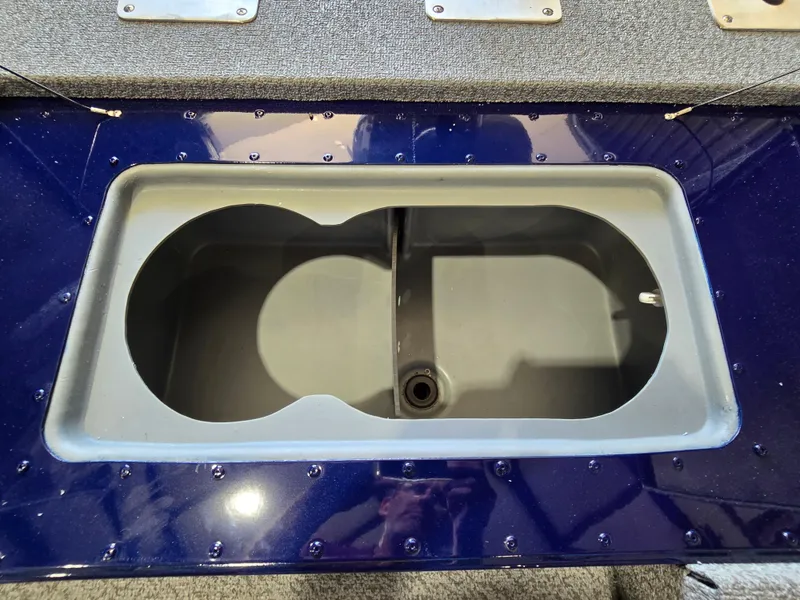 Slide: The Image of Livewell compartment in 2025 G3 Sportsman 1710 boat, featuring a dual-section design. - 9