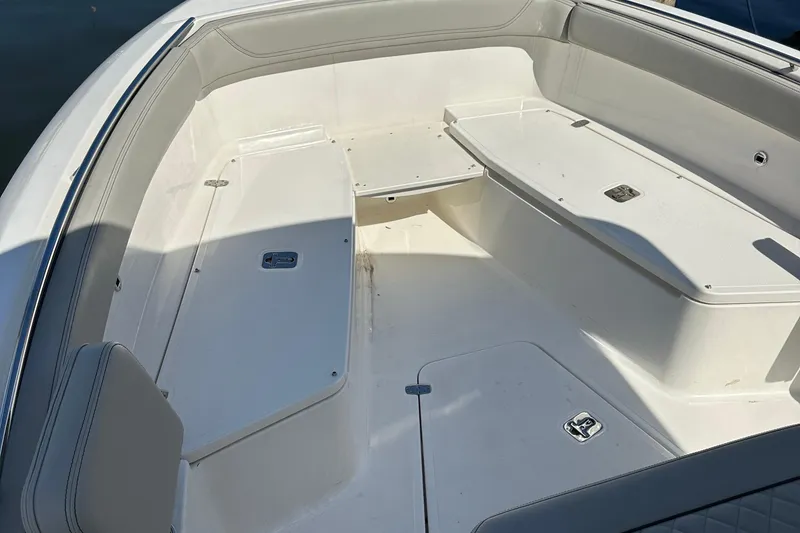 Slide: The Image of 2024 Pursuit S 268 Sport boat interior with spacious seating and storage. - 10