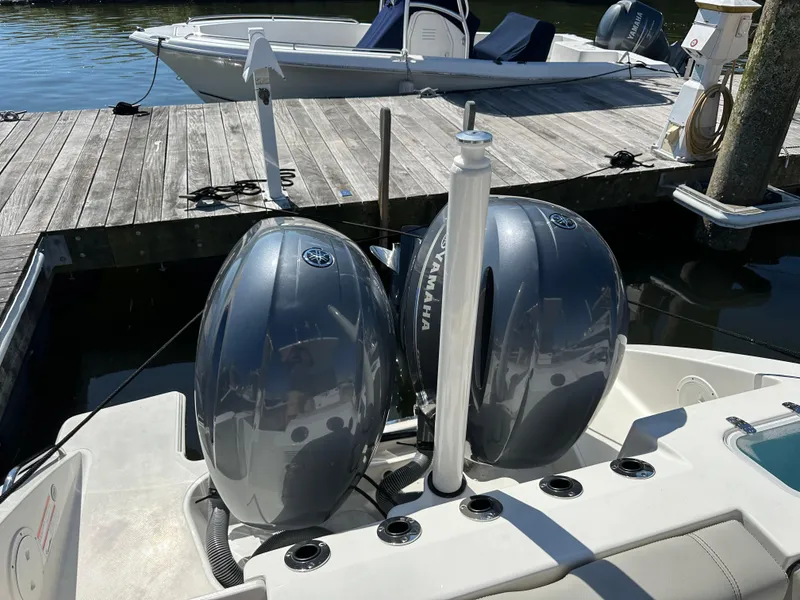 Slide: The Image of 2024 Pursuit S 268 Sport boat with dual Yamaha outboard engines at dock. - 12