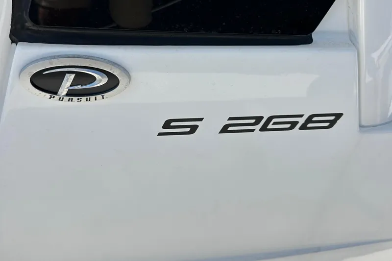 Slide: The Image of 2024 Pursuit S 268 Sport boat emblem and model badge. - 4