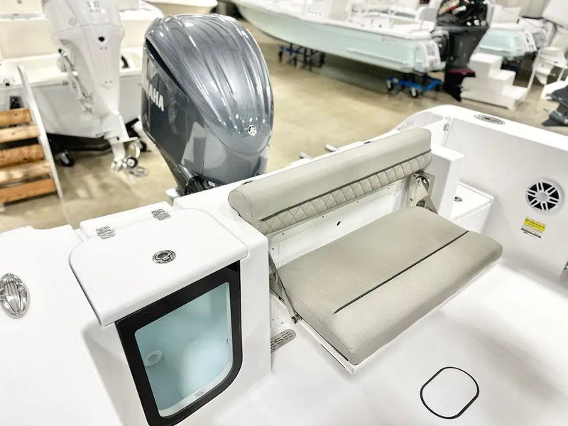 Slide: The Image of 2025 Sportsman Open 232 boat with Yamaha engine, featuring a foldable seat and storage compartment. - 12