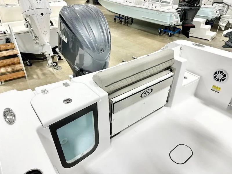 Slide: The Image of 2025 Sportsman Open 232 boat interior with Yamaha engine, featuring seating and storage compartments. - 4