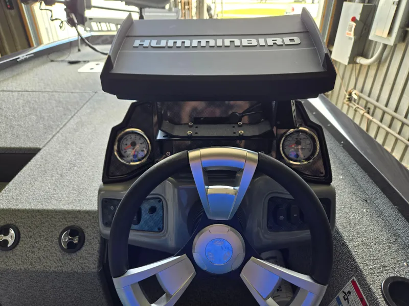 Slide: The Image of 2025 G3 Sportsman 1810 PFX boat dashboard with Humminbird display and steering wheel. - 10