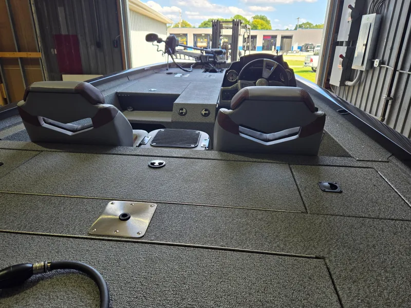 Slide: The Image of 2025 G3 Sportsman 1810 PFX boat interior with dual seats and control panel. - 18