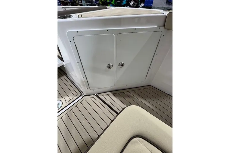 Slide: The Image of 2025 Yamaha Boats 252 FSH Sport interior, featuring sleek storage compartment and stylish flooring. - 10