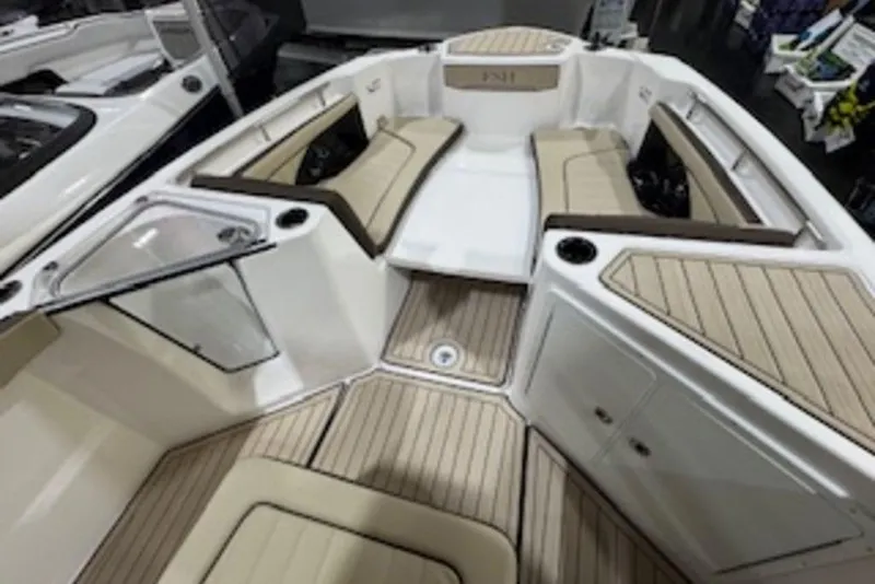 Slide: The Image of 2025 Yamaha Boats 252 FSH Sport interior with beige seating and sleek design. - 9