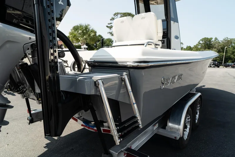 Slide: The Image of 2025 ShearWater 27 Carolina Open boat on trailer, rear view. - 10