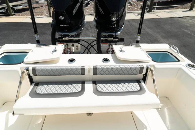 Slide: The Image of 2025 ShearWater 27 Carolina Open boat with dual engines and cushioned seating. - 12