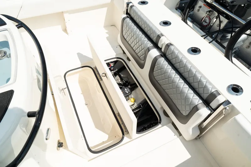 Slide: The Image of 2025 ShearWater 27 Carolina Open boat interior with storage compartments and seating. - 13