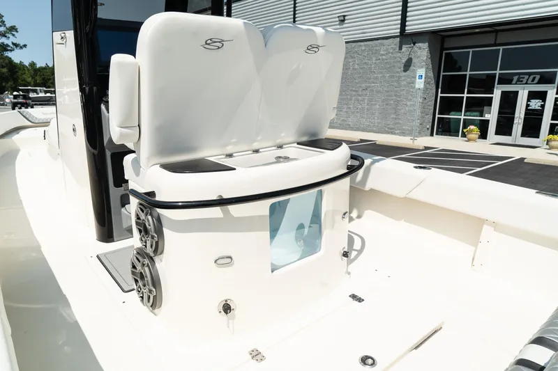 Slide: The Image of 2025 ShearWater 27 Carolina Open boat interior with seating and speakers. - 15