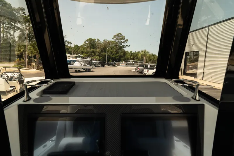 Slide: The Image of Interior view of 2025 ShearWater 27 Carolina Open boat dashboard. - 21