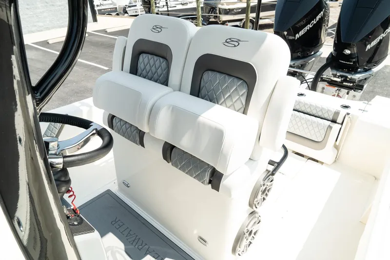 Slide: The Image of 2025 ShearWater 27 Carolina Open boat with luxury seating and dual Mercury engines. - 23