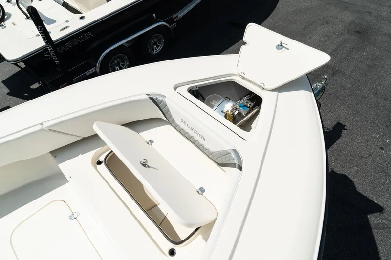 Slide: The Image of 2025 ShearWater 27 Carolina Open boat with open storage compartments. - 28
