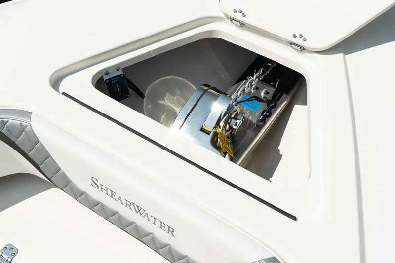 Slide: The Image of 2025 ShearWater 27 Carolina Open boat compartment with visible equipment. - 29