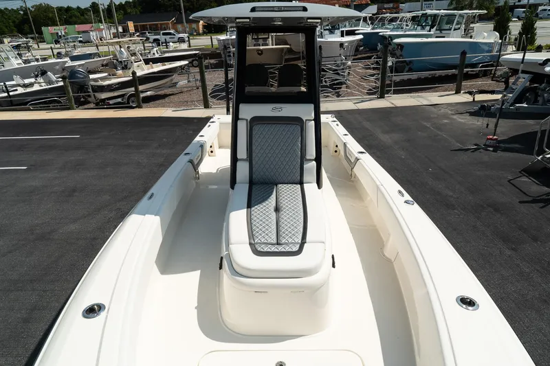 Slide: The Image of 2025 ShearWater 27 Carolina Open boat, spacious deck, modern design, docked at marina. - 30