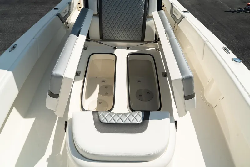 Slide: The Image of 2025 ShearWater 27 Carolina Open boat interior with open storage compartments. - 33
