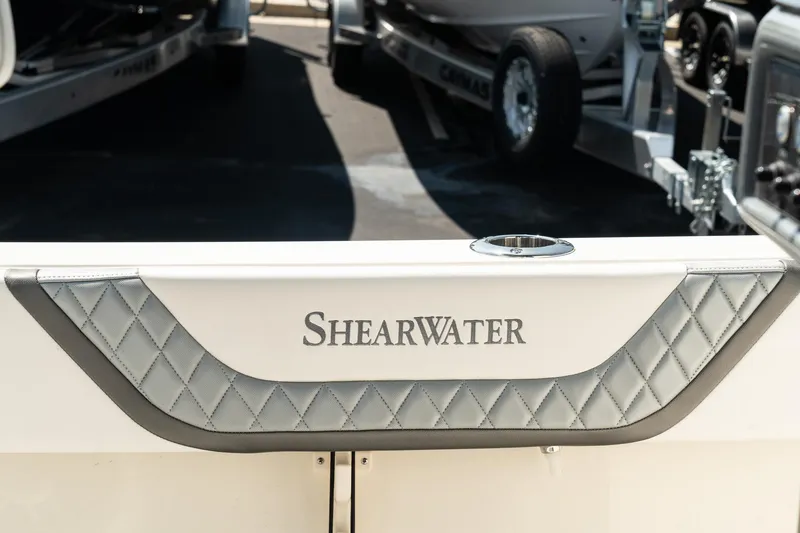 Slide: The Image of 2025 ShearWater 27 Carolina Open boat, featuring elegant diamond-patterned upholstery. - 36