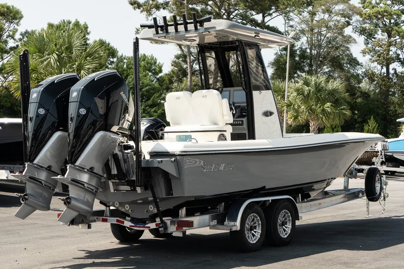 Slide: The Image of 2025 ShearWater 27 Carolina Open boat on trailer with dual engines. - 6