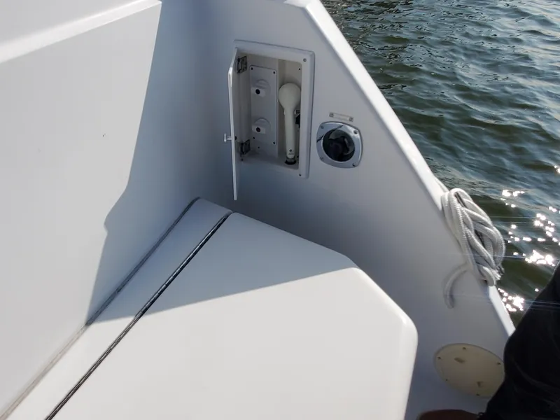 Slide: The Image of 2000 Carver 356 Aft Cabin Motor Yacht deck detail with water access panel. - 15