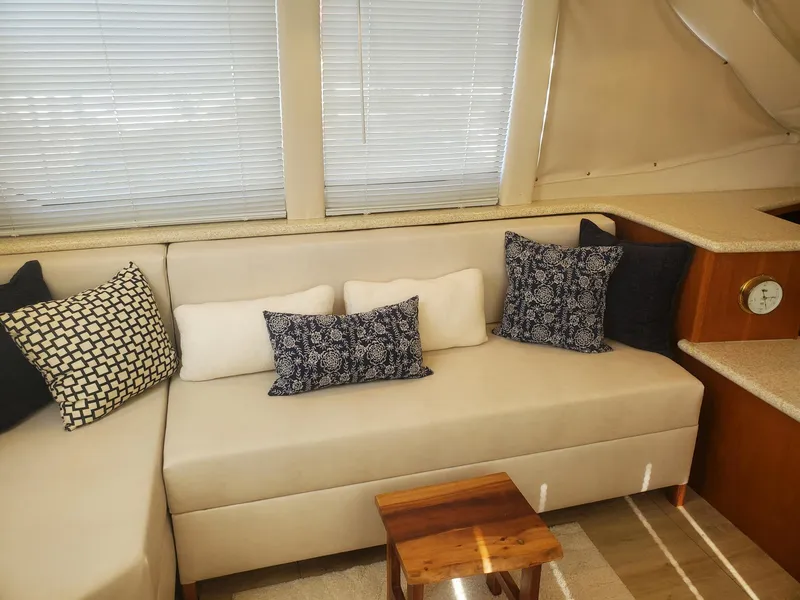 Slide: The Image of Interior of 2000 Carver 356 Aft Cabin Motor Yacht with cozy seating and decorative pillows. - 20