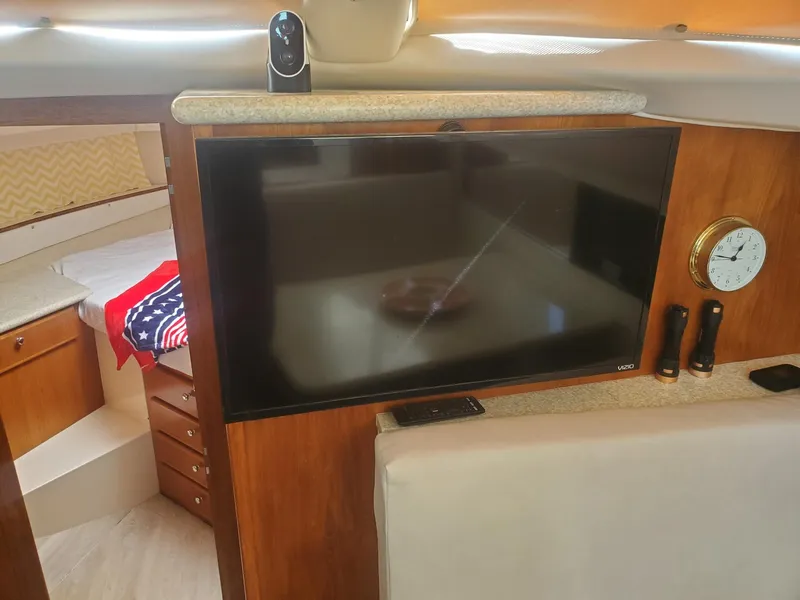 Slide: The Image of Interior of 2000 Carver 356 Aft Cabin Motor Yacht with TV and clock. - 24
