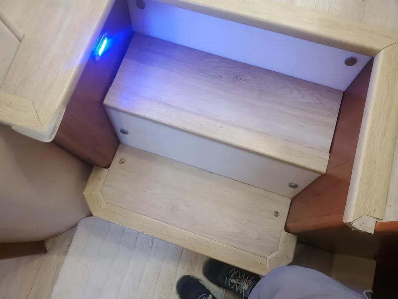 Slide: The Image of Wooden steps with blue LED light on Carver 356 Aft Cabin Motor Yacht, 2000 model. - 25