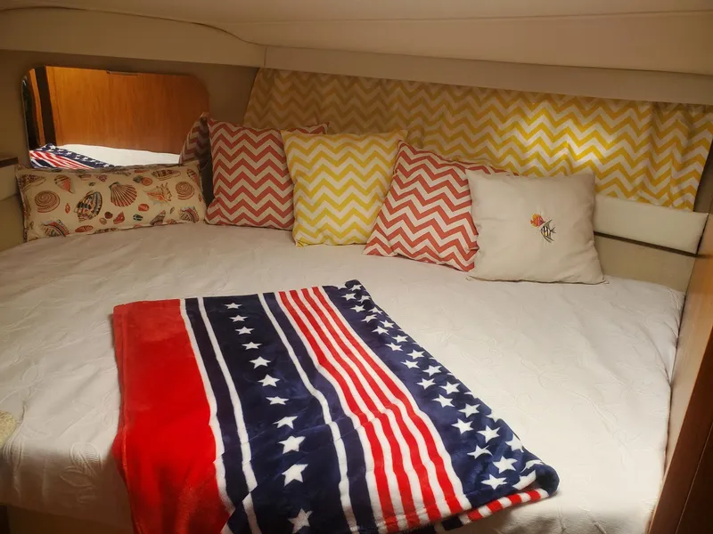 Slide: The Image of Cozy cabin interior of 2000 Carver 356 Aft Cabin Motor Yacht with colorful pillows and blanket. - 28