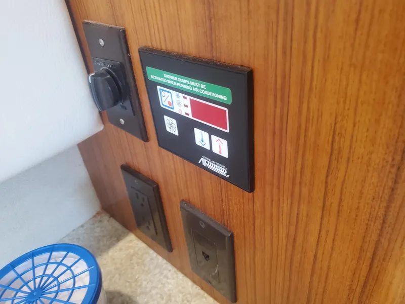 Slide: The Image of Control panel on 2000 Carver 356 Aft Cabin Motor Yacht interior wood paneling. - 39