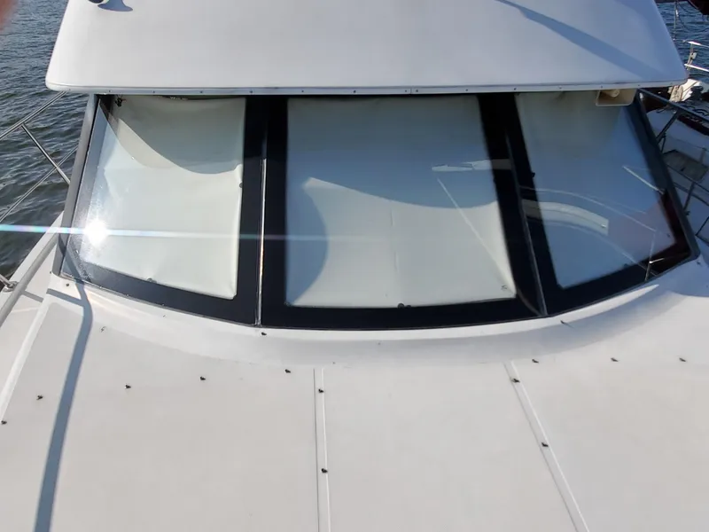 Slide: The Image of Carver 356 Aft Cabin Motor Yacht 2000, front view with large windows. - 4