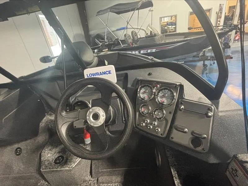 Slide: The Image of 2025 Tracker PG V175 CB boat dashboard with steering wheel and gauges. - 3
