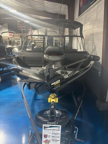 Slide: The Image of 2025 Tracker PG V175 CB boat with Minn Kota trolling motor in showroom. - 4