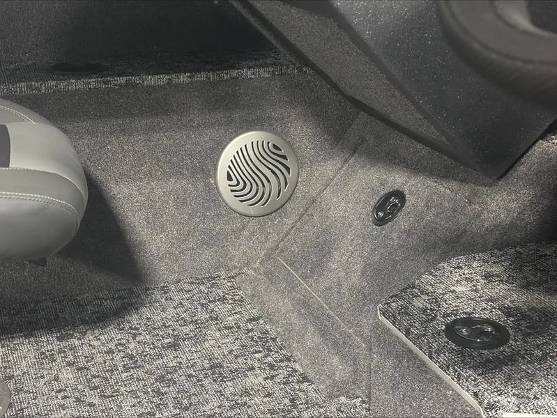 Slide: The Image of 2025 Tracker PG V175 CB interior with speaker and carpeted flooring. - 5