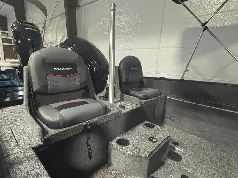 Slide: The Image of 2025 Tracker PG V175 CB boat interior with cushioned seats and storage compartments. - 8