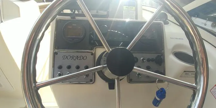 Slide: The Image of Steering wheel and dashboard of a 2013 Scout 210 Dorado boat. - 20