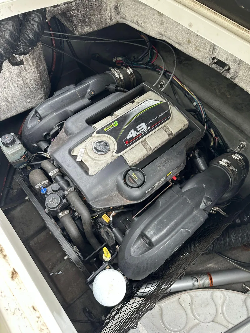 Slide: The Image of 2012 Chaparral 220 SSi boat engine, 4.3L V6, in engine compartment. - 14