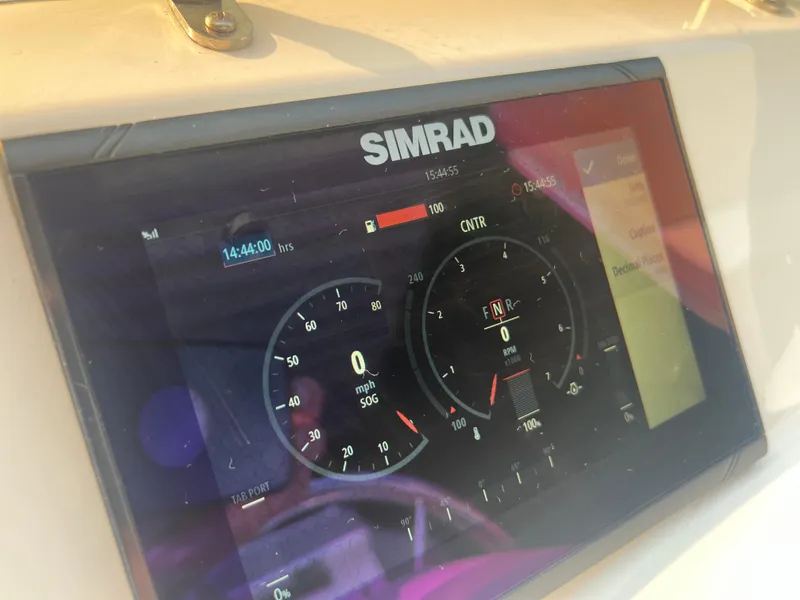 Slide: The Image of Simrad display on 2022 Walker Bay Generation 400 boat dashboard. - 10
