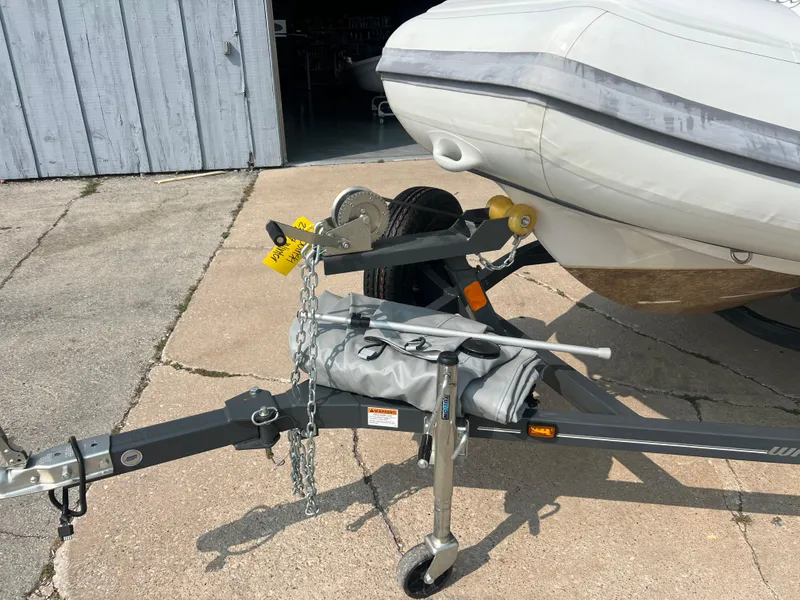 Slide: The Image of 2022 Walker Bay Generation 400 boat trailer with hitch and safety chains. - 11