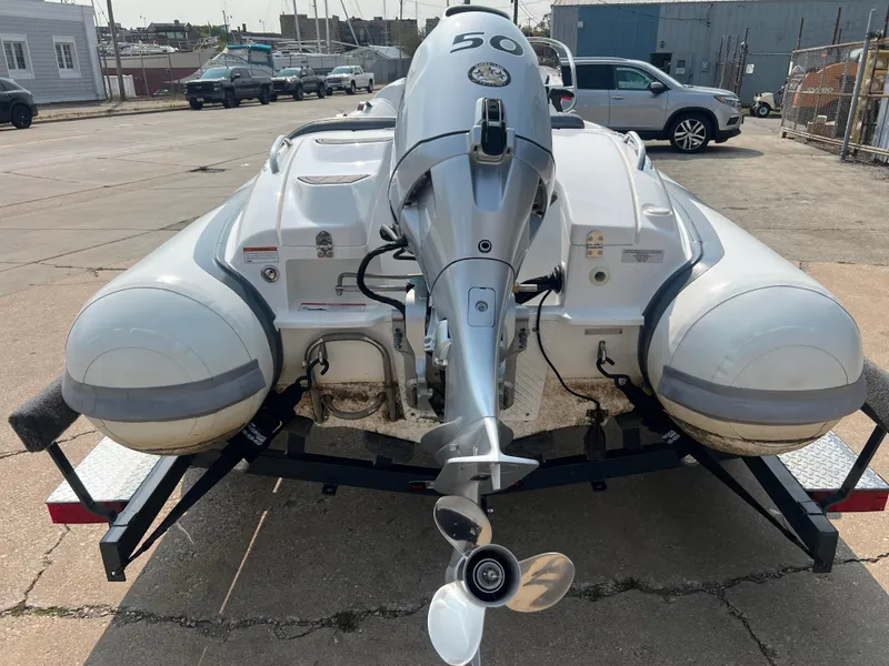 Slide: The Image of 2022 Walker Bay Generation 400 inflatable boat with outboard motor on trailer. - 3